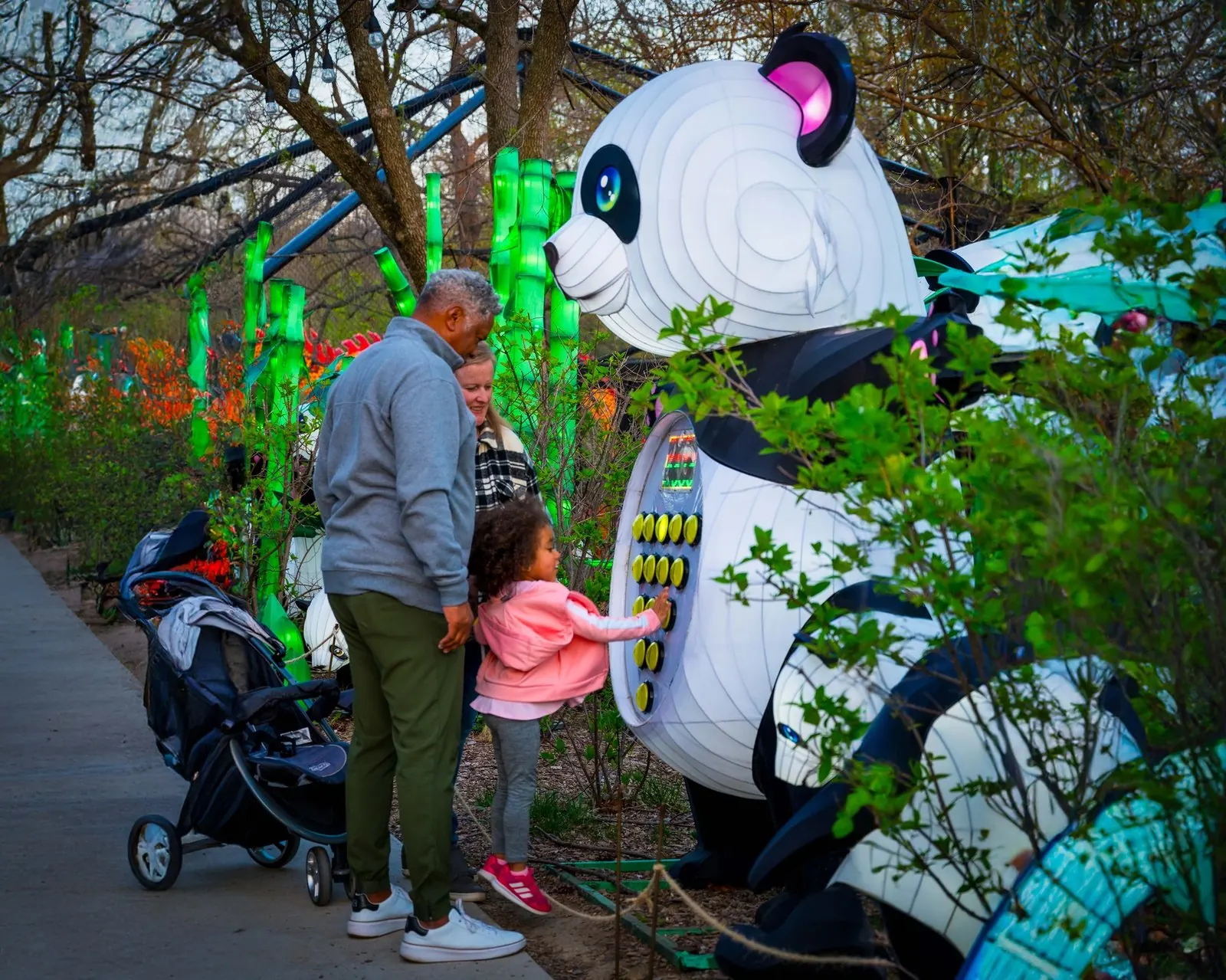 Interactive panda lantern with visitors at a zoo